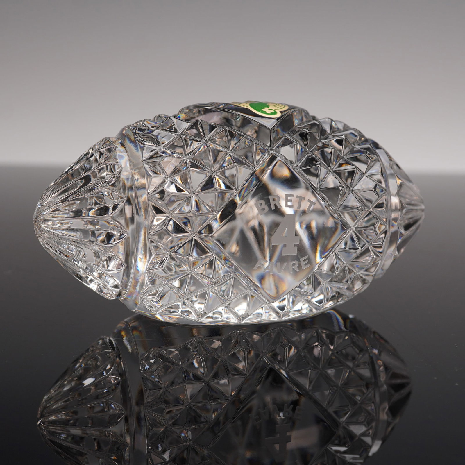 Waterford Crystal Brett Favre Limited Edition Football: Waterford crystal Brett Favre limited edition football, cut in a traditional diamond pattern with a central panel etched with Favre's name and number 4. The base bears the Waterford mark and Brett Fav