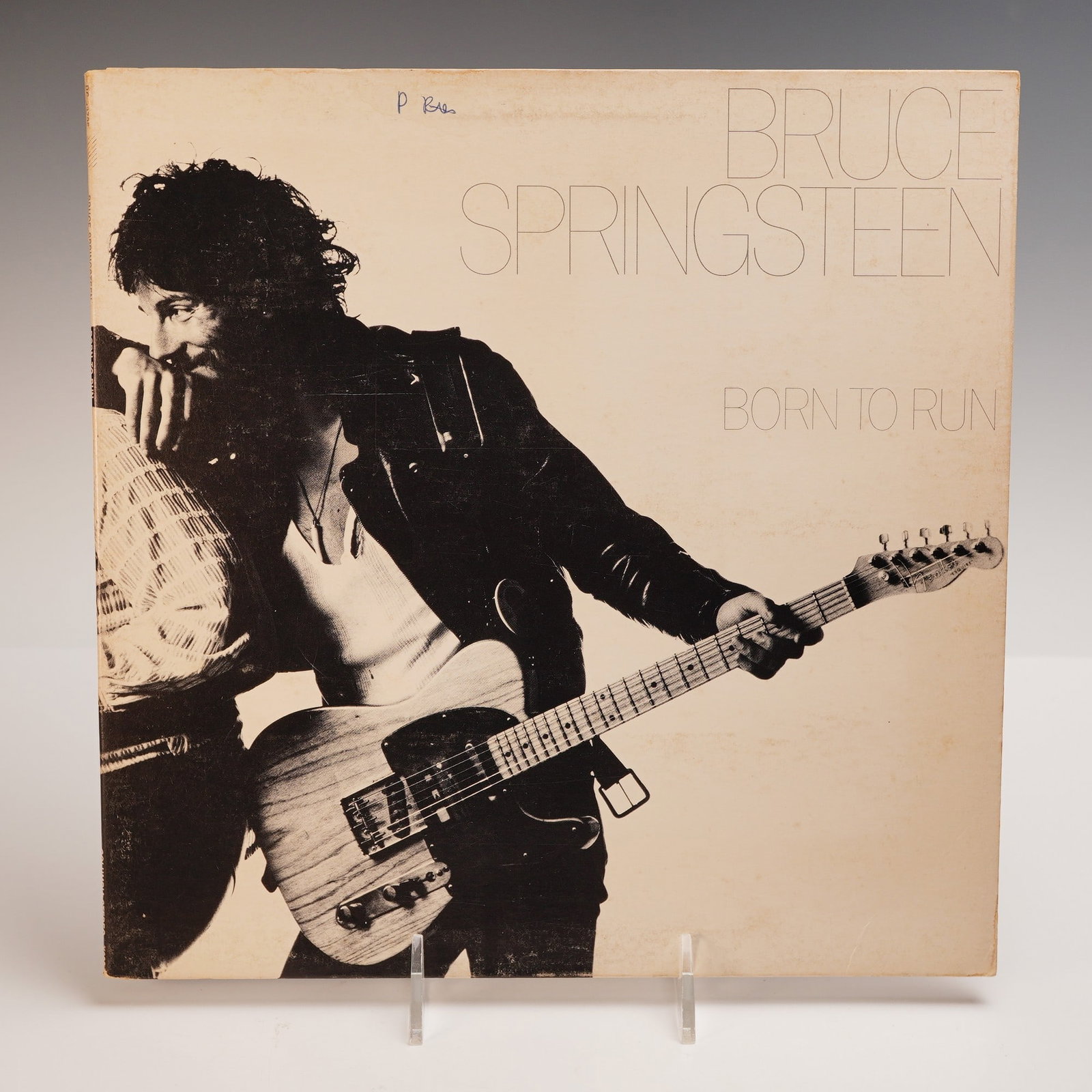 Bruce Springsteen: Born to Run LP Record: Original 1975 LP record titled Born to Run by Bruce Springsteen, released by Columbia Records under catalog number PC 33795. The iconic front cover features a black-and-white photograph by Eric Meola