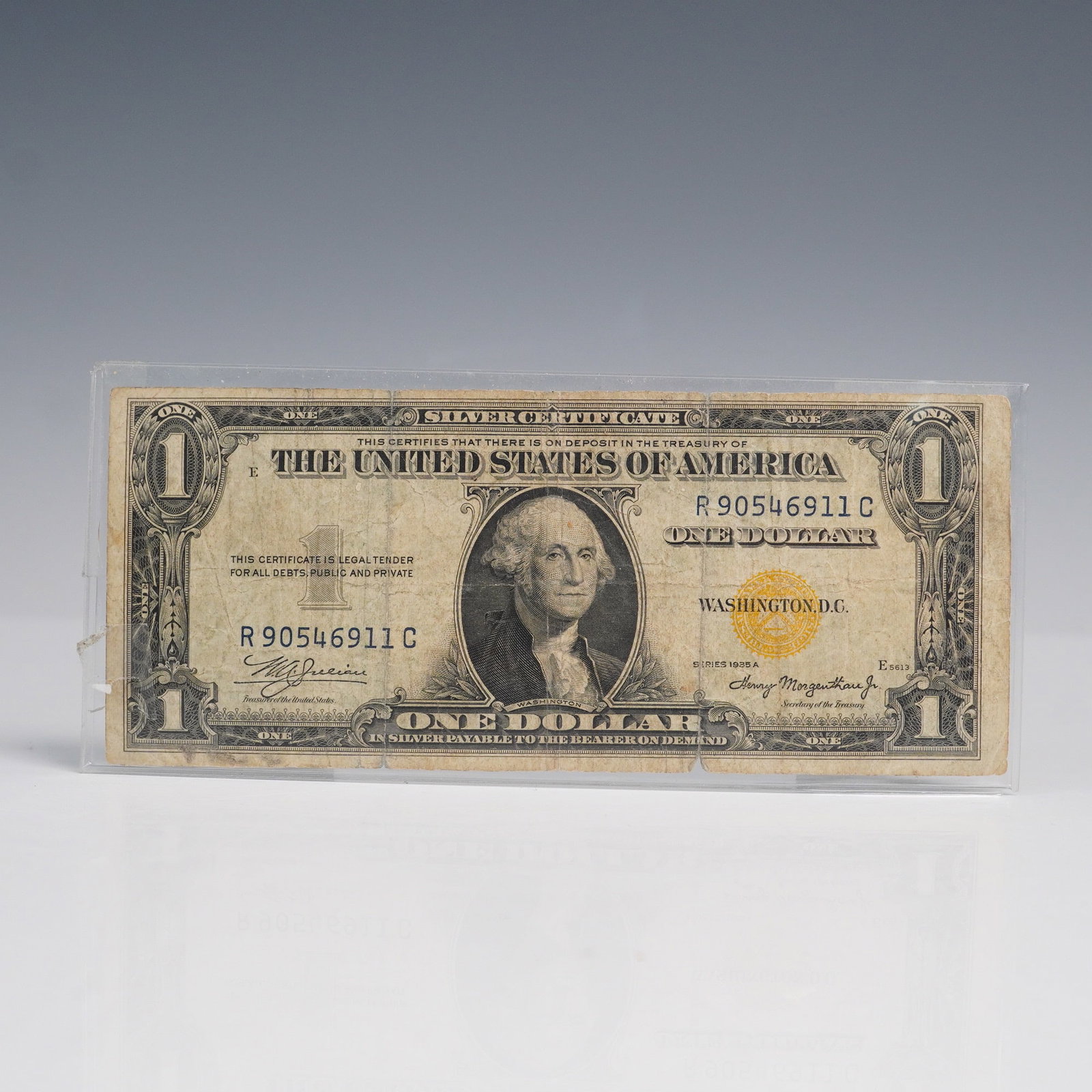 1935-A $1 U.S North Africa Silver Certificate Yellow Seal: This is a Series of 1935A $1 Silver Certificate prominently featuring a yellow Treasury seal and blue serial numbers, issued with the serial R90546911C. The "A" indicates the year in which a new desig