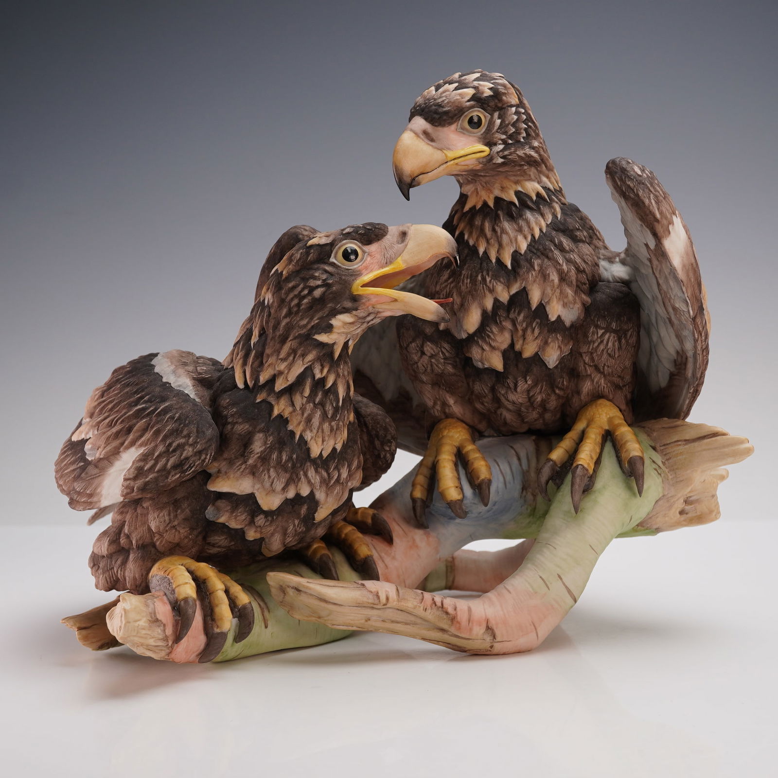 Boehm Porcelain Figurine, American Bald Eagle: Young and Spirited. Commemorating the US Nation's 200th Anniversary. Matte porcelain modeled as two bald eagles in naturalistic setting. Boehm Made in U. S. A. backstamp. Artist: Edward Marshall Boehm