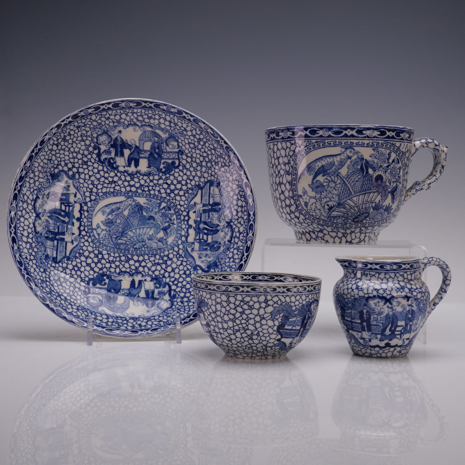4pc Adams England Porcelain Blue and White Chinese Pattern, Cups & Bowls: A four-piece set of Adams England porcelain in classic blue and white Chinese-inspired pattern, comprised of two cups, one small jug, and a bowl. Each piece is decorated with finely detailed figural a