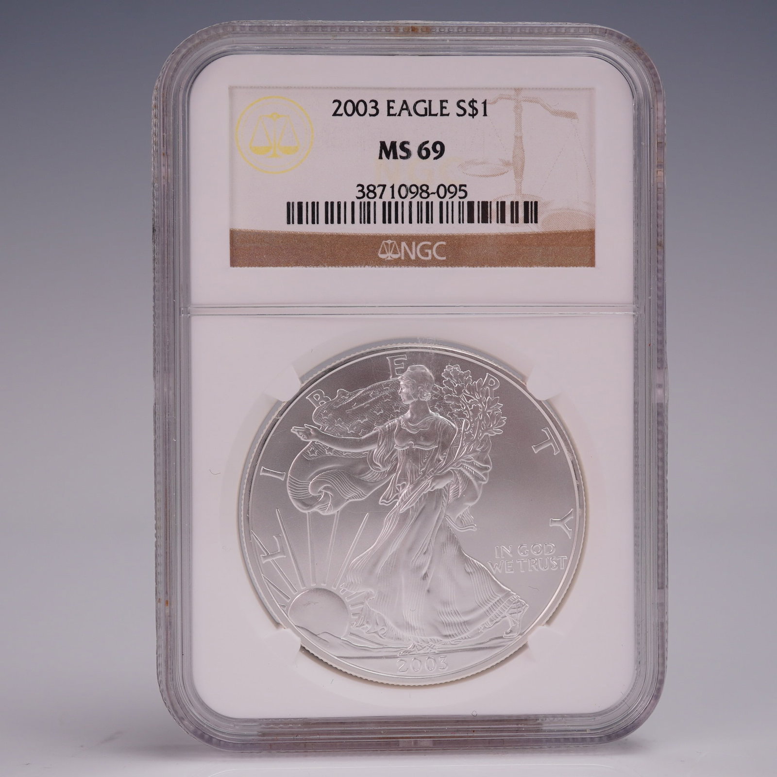 2003 American Silver Eagle Dollar Coin NGC Graded MS 69: Struck in one troy ounce of .999 fine silver and graded Mint State 69 by NGC. This 2003 American Silver Eagle dollar bears the iconic design of Walking Liberty by Adolph A. Weinman, her flowing robes 