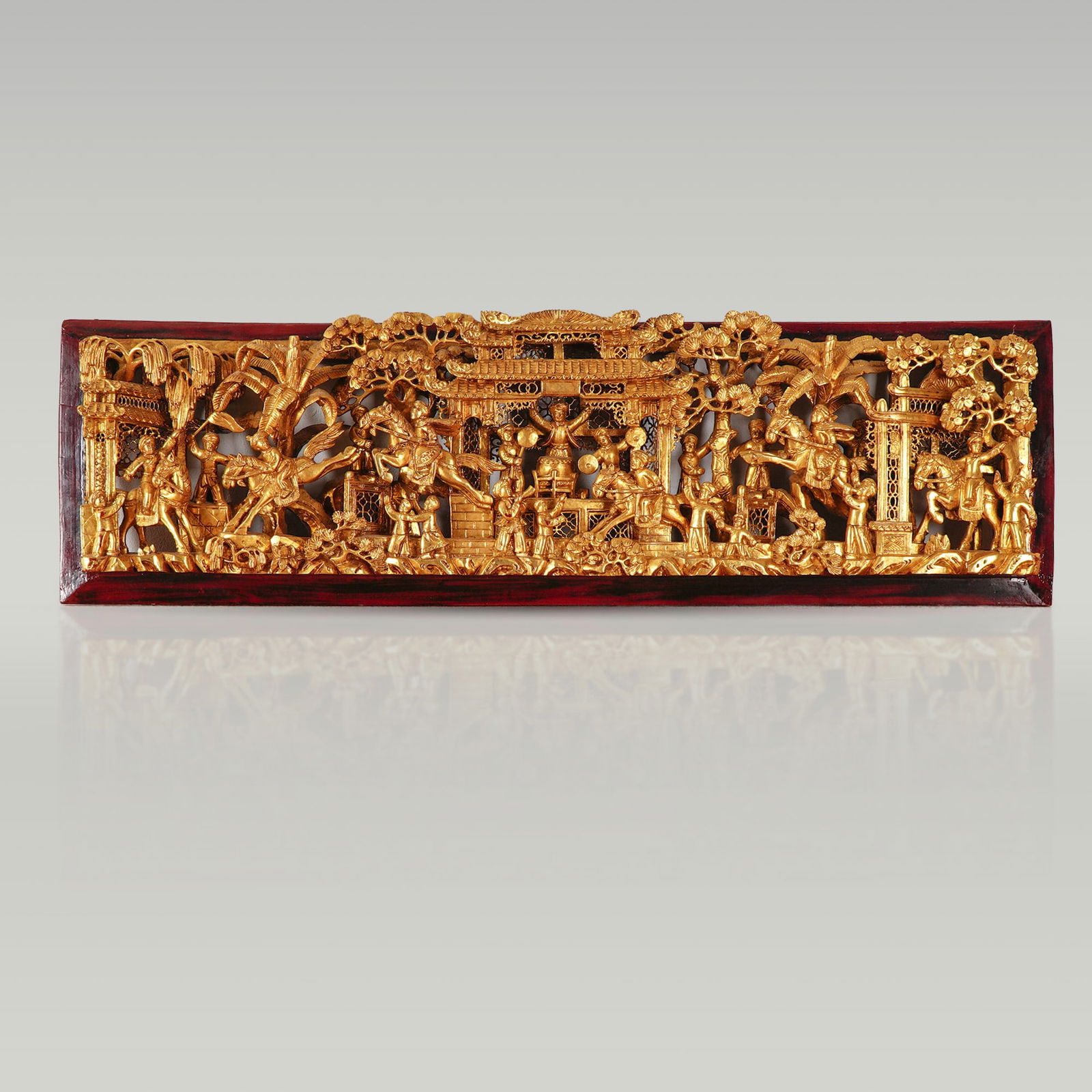 Authentic Chinese Giltwood Temple Panel with Festival Scene: An exceptional antique Chinese gilt wood carving panel, finely detailed with a dynamic celebration scene featuring musicians, dancers, warriors on horseback, and flag bearers. Richly gilded, the deep