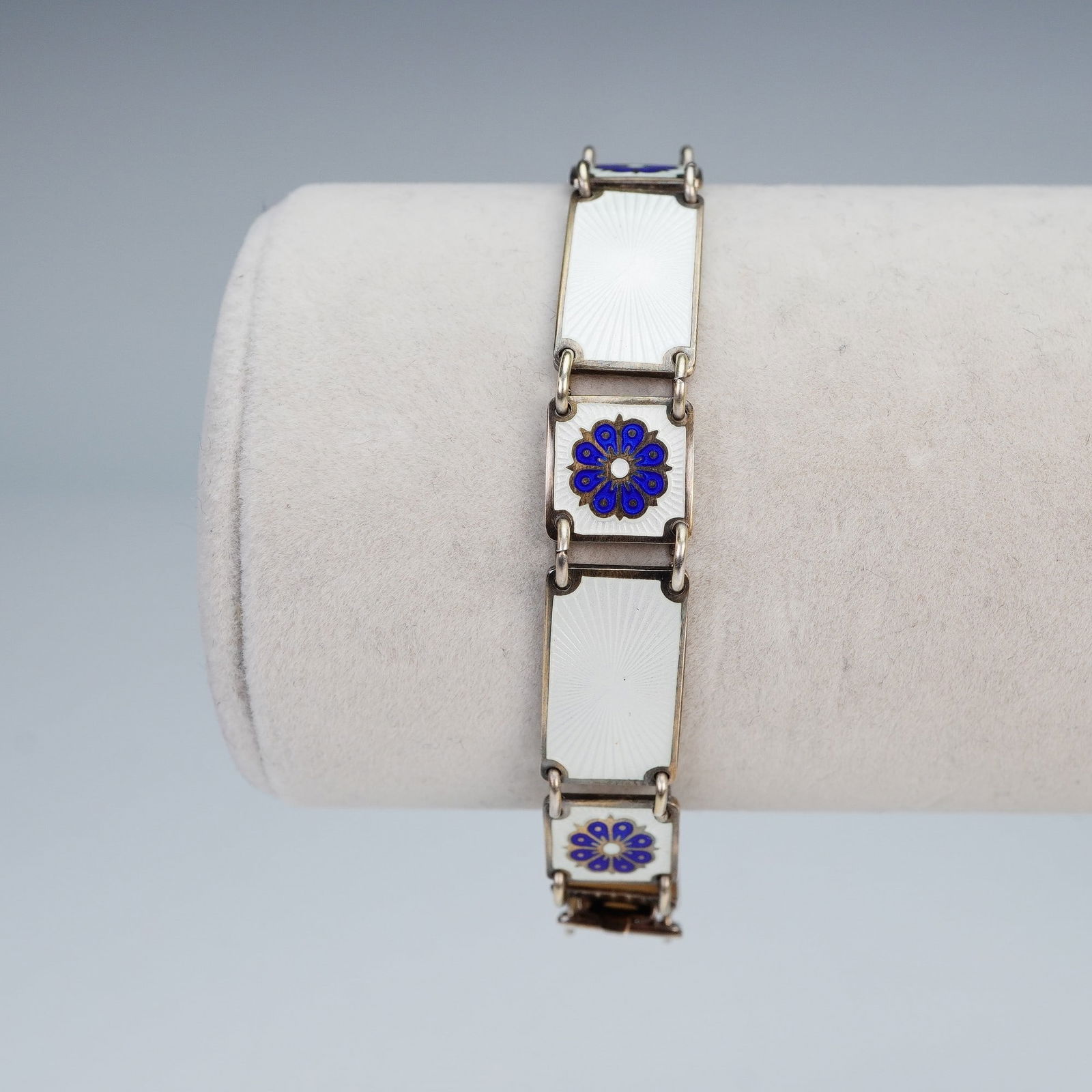 David-Andersen Sterling Silver Guilloche Enamel Bracelet: A vintage sterling silver bracelet by David-Andersen of Norway, marked "925S" and "Norway Sterling." The bracelet features rectangular white guilloche enamel panels, each decorated with a vibrant blue