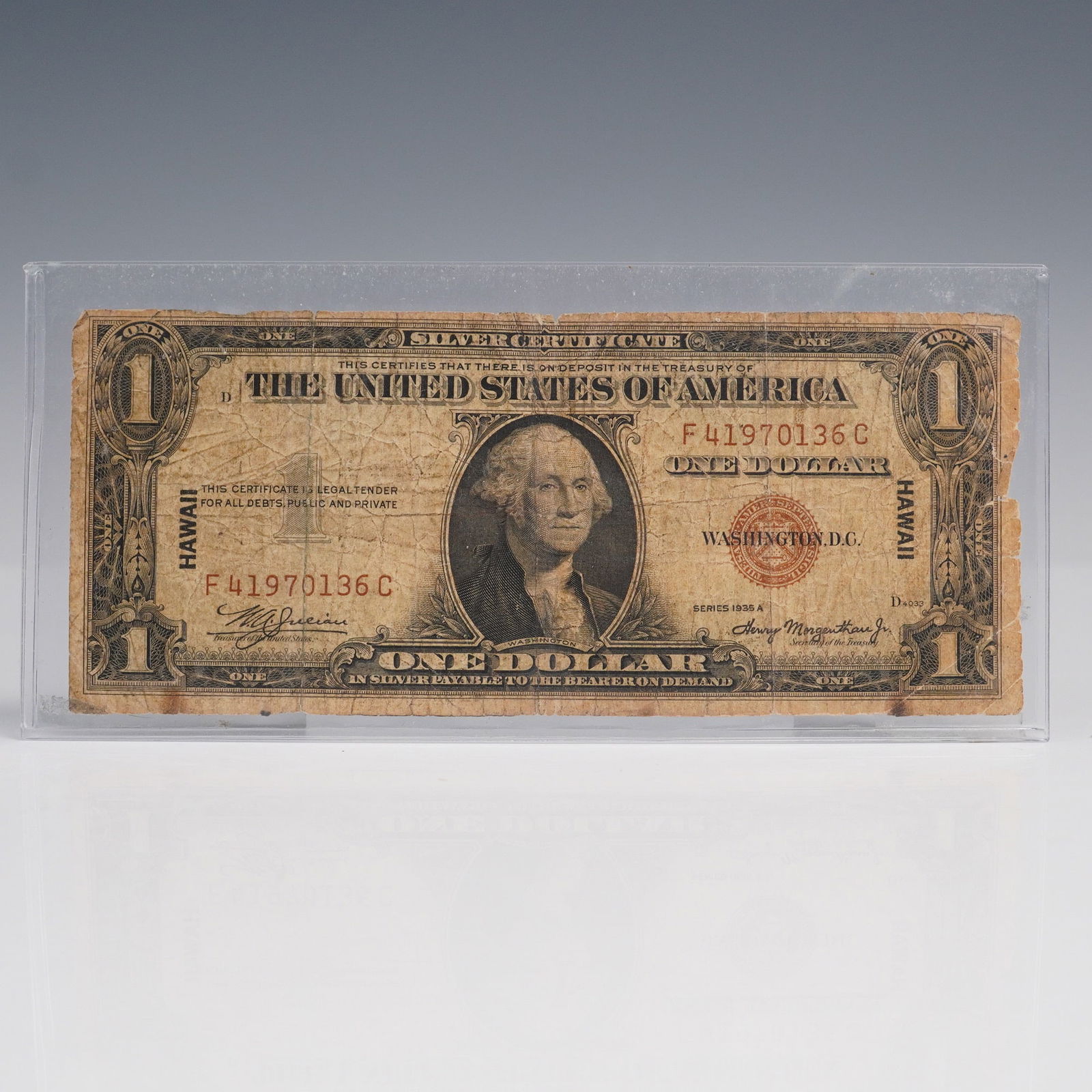 1935A $1 Silver Certificate WWII Hawaii Overprint Banknote: A 1935A Series $1 Silver Certificate issued as part of the Hawaii Emergency Currency during World War II. Issued under the authorization of Treasury officials W.A. Julian and Henry Morgenthau Jr., thi
