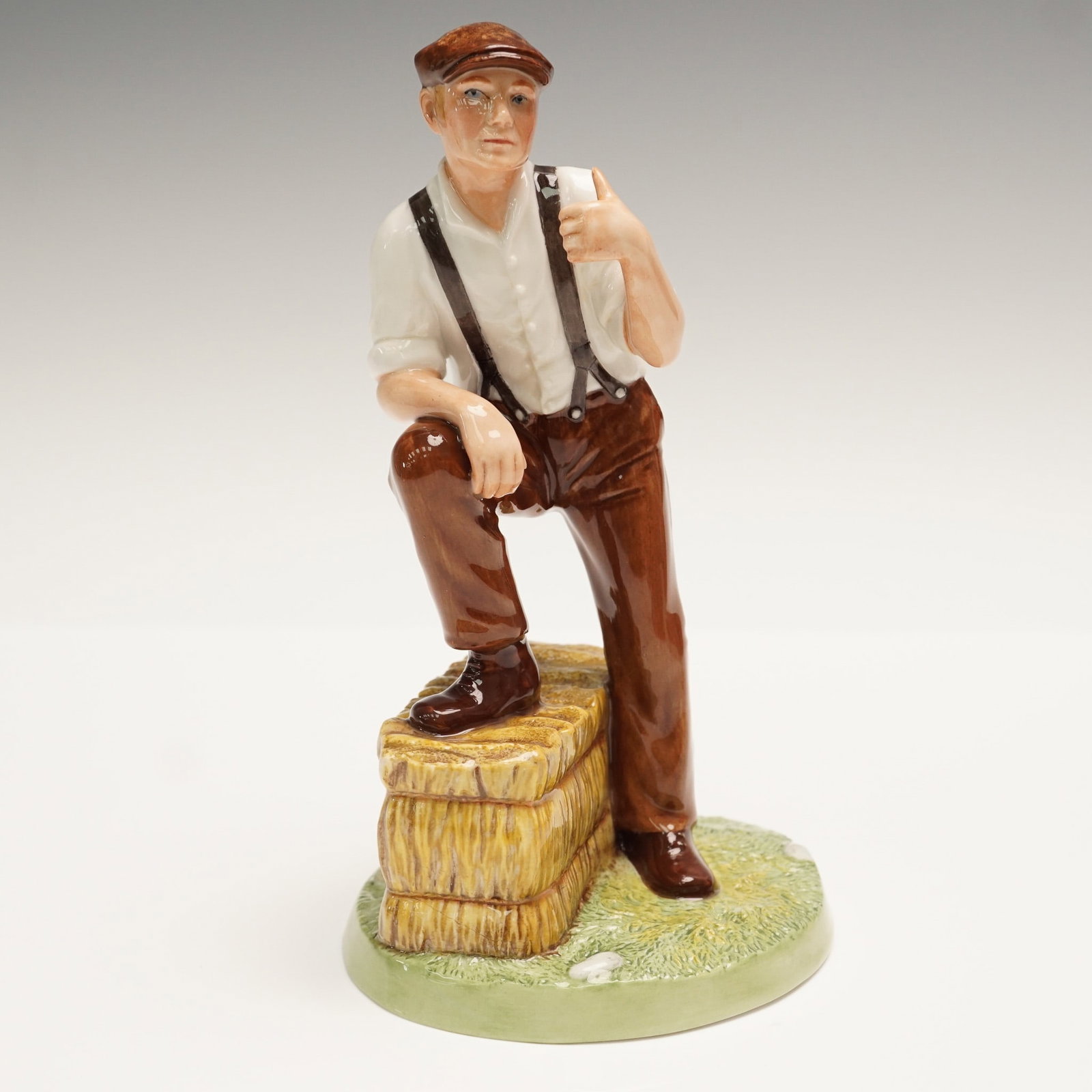 Royal Doulton Figurine, Farmer HN4487: Royal Doulton fine china figurine titled Farmer, model HN4487, from the Classics collection. Designed by Adrian Hughes and issued in 2002, this hand-decorated figure portrays a relaxed rural gentleman