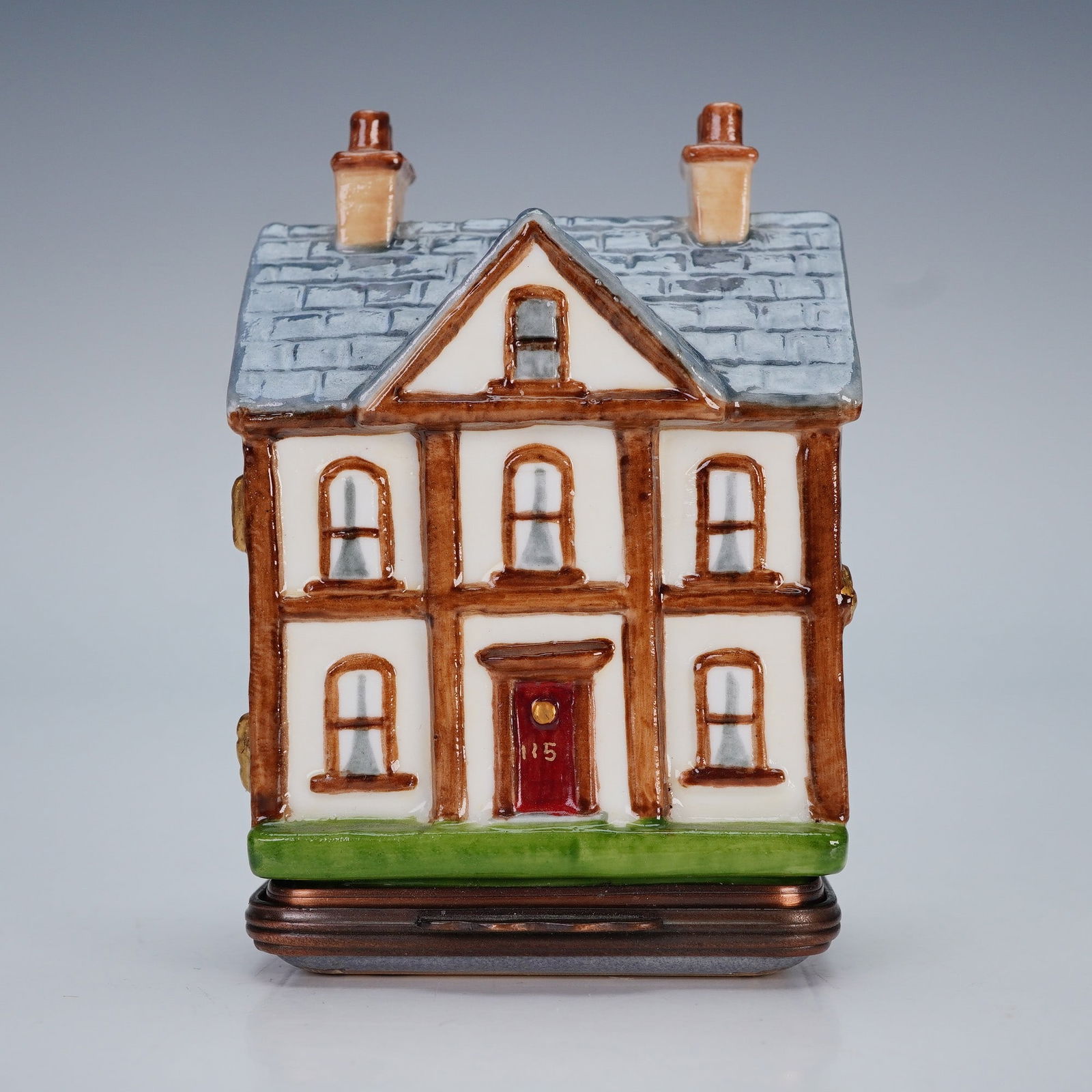 Halcyon Days Enamel Bonbonniere, Doll House: A beautiful enamel bonbonniere fashioned in the form of a Regency-style doll's house, its design inspired by an early nineteenth century example dating from circa 1815. Painted with a white facade, re
