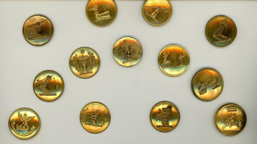 A small card of division one livery buttons