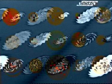 A small card of division 1 & 3 assorted material buttons