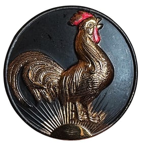 A division three black glass pictorial lustered button