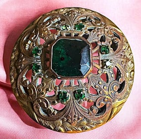 A division one glass in metal button