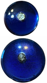 A pair of division one glass and paste buttons