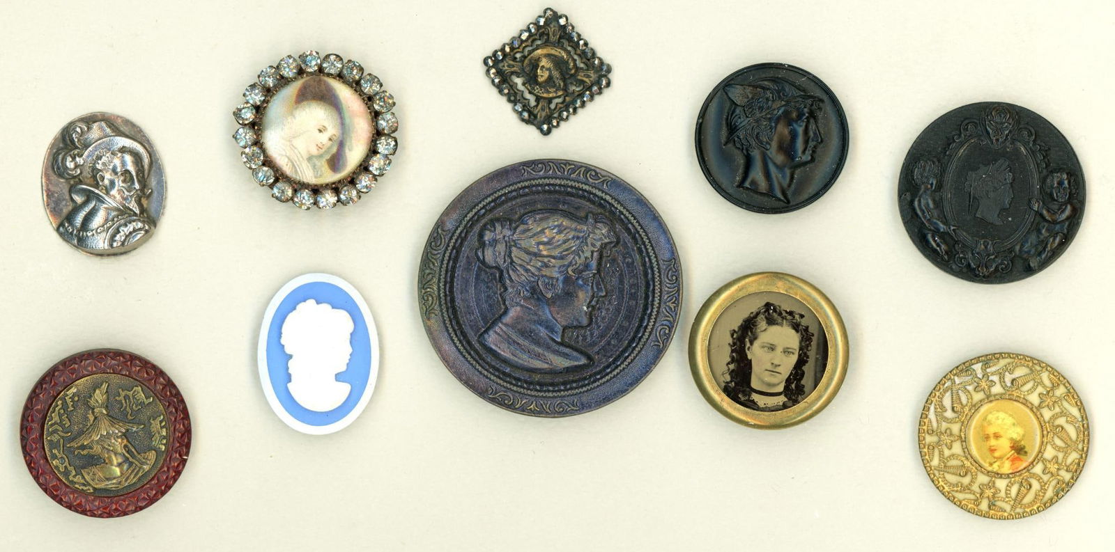 A small card of division one head buttons (1 of 4)