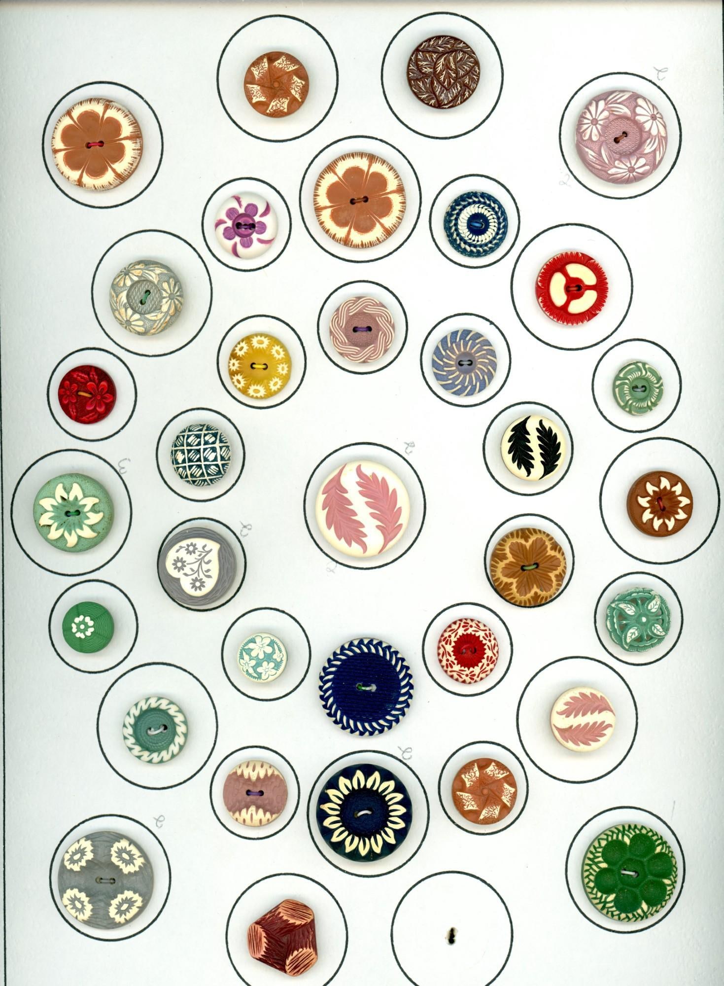 A card of division three celluloid buttons (1 of 4)