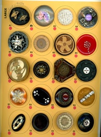 A card of division three assorted plastic buttons