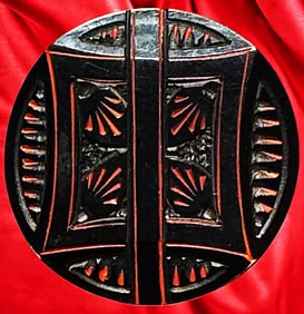 A division one patterned Casein button