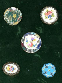 A small card of division one enamel buttons