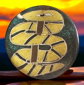 A division three hand made pottery button