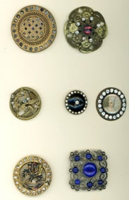 A small card of division one jeweled buttons