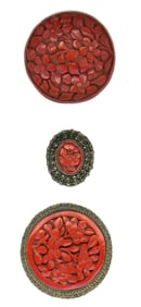 A small card of division one Cinnabar buttons