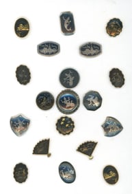 A small card of division three Asian metal buttons