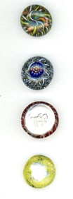 A small card of division three studio artist buttons