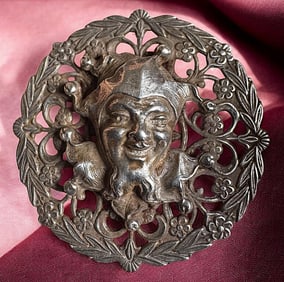A division one pierced silver figural button