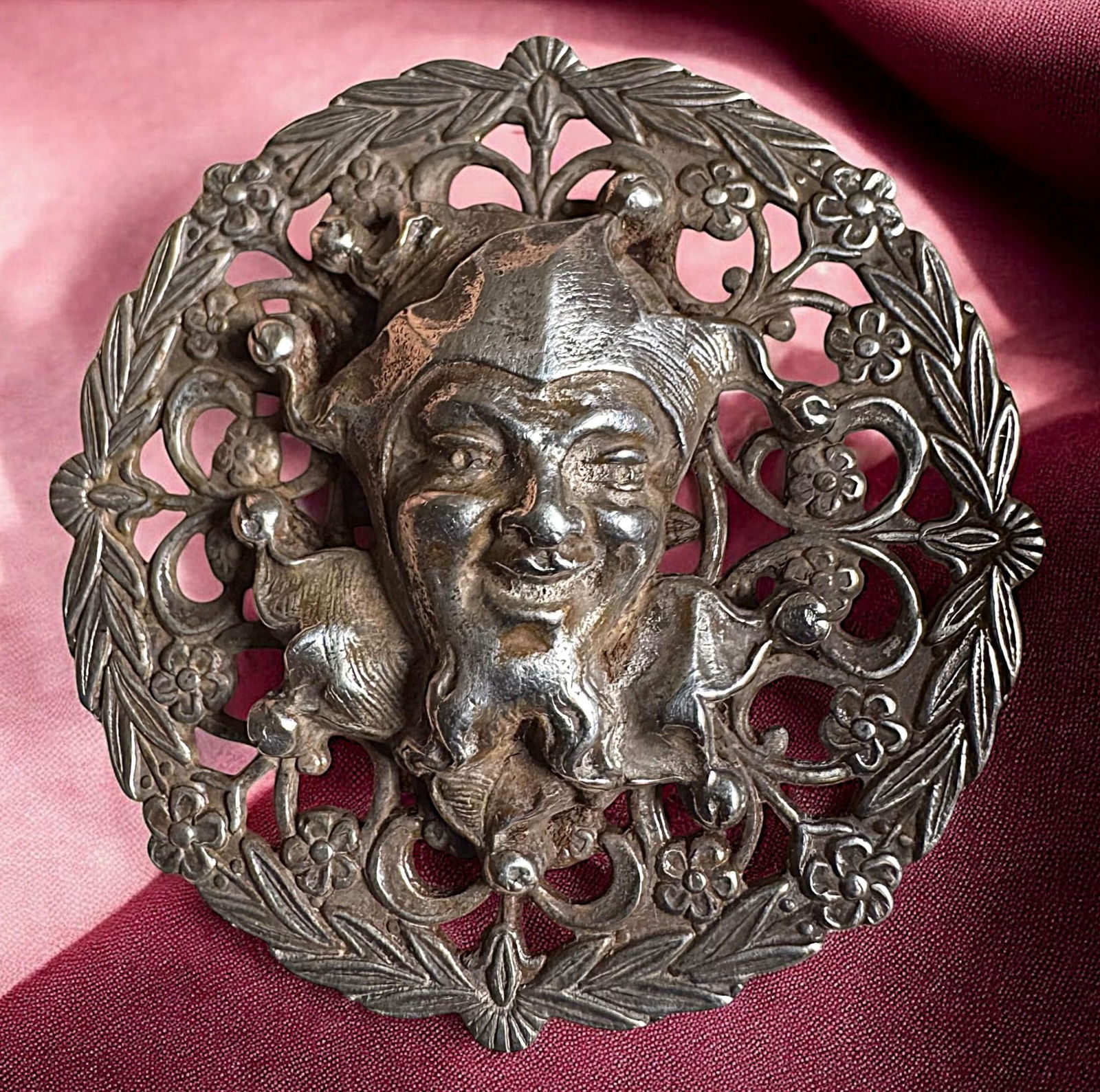 A division one pierced silver figural button (1 of 3)