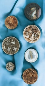 A small card of assorted division one glass buttons