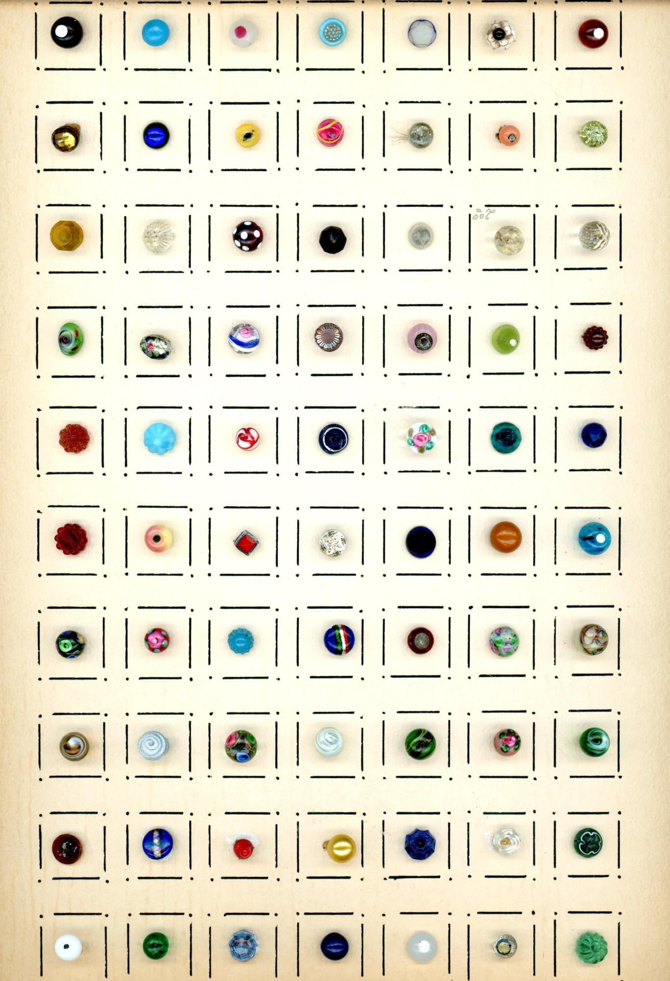 A card of division one glass buttons (1 of 6)