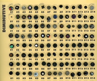 A selection of division one black glass buttons