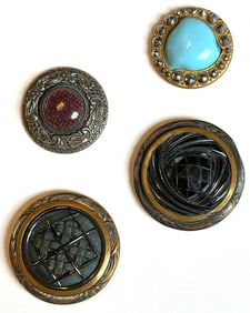 A small card of division one Glass in metal buttons