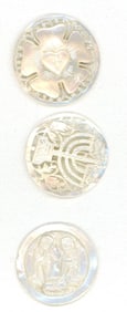 A small card of division three carved pearl buttons