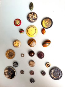 A card of division 1 & 3 assorted celluloid buttons