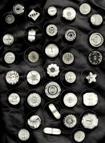 A card of division three clear glass buttons