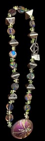 A beautiful handmade necklace with a button
