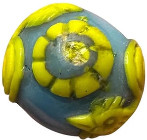 A division three hand crafted glass button