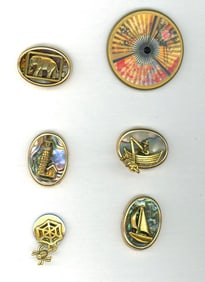 A small card of division three studio artist buttons.