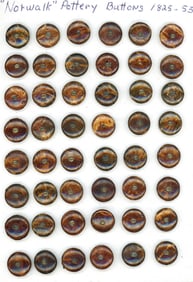 A card of division one pottery buttons