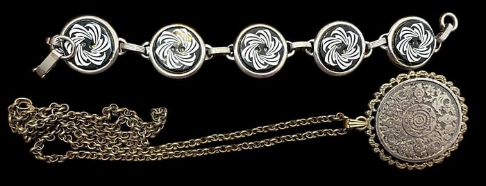 A small group of a Necklace and bracelet with buttons