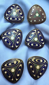 A small card of division one enamel buttons