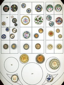 A card of division one enamel & litho buttons