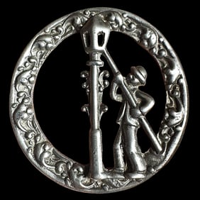 A division three pierced white metal figural button