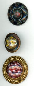 A small card of division one glass in metal buttons