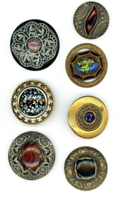 A small card of glass in metal buttons