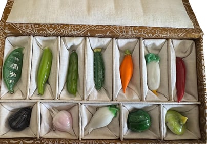 An original box set of handcrafted glass buttons