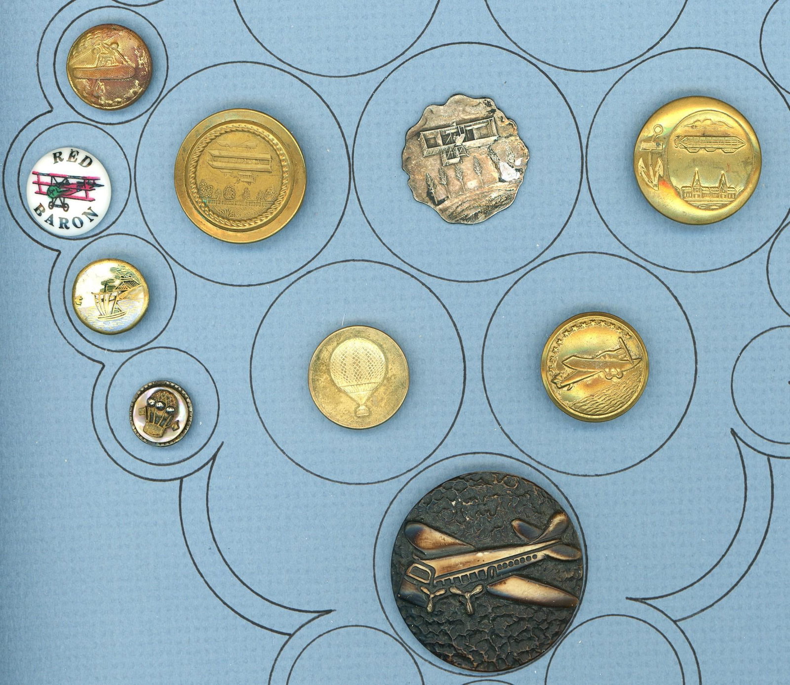 A card of division one and three transpiration buttons: 10 Small/Medium/Large 19th/20th century examples. This very nice selection includes some wonderful Balloon examples and some unusual airplane examples. The lot also includes a colorful 20th century Ja
