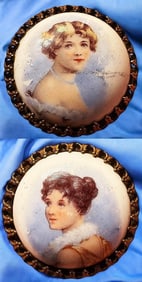 A pair of div. hand colored porcelain head buttons