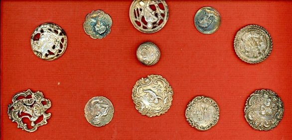 A partial card of assorted hallmarked silver buttons