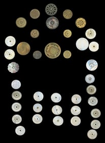 A card of early metal and pearl buttons